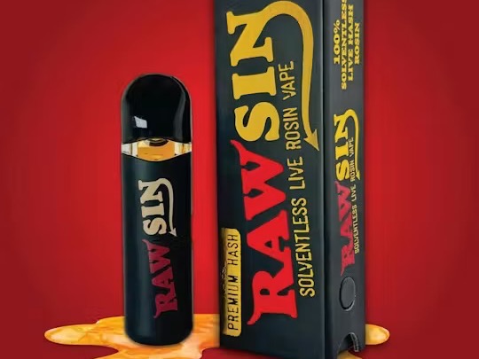 Rawsin live rosin vape and box on red.