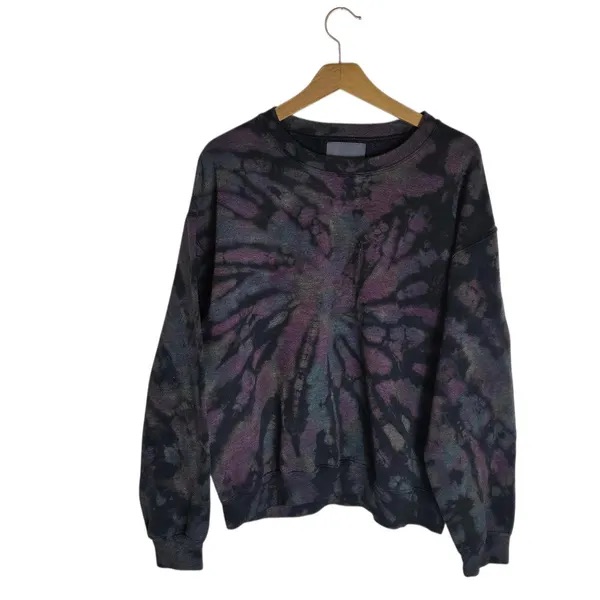 Dark tie-dye crew sweatshirt on a hanger.