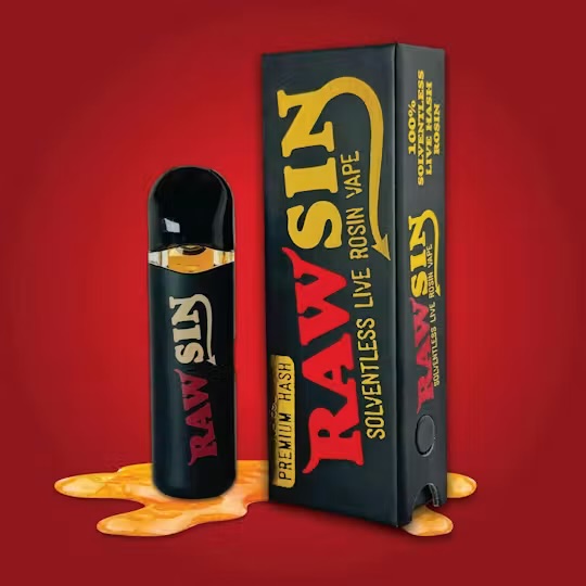 Rawsin solventless live rosin vape: black device with gold and red Rawsin wordmark beside its box, on a red backdrop with a pool of golden rosin.